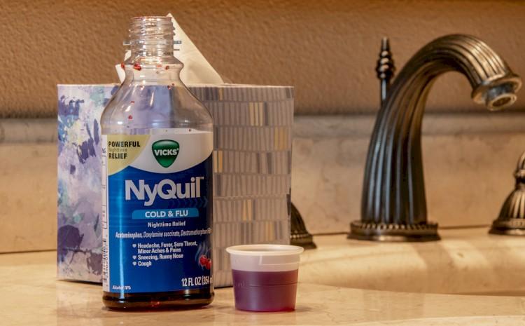 NyQuil bottle on bathroom counter